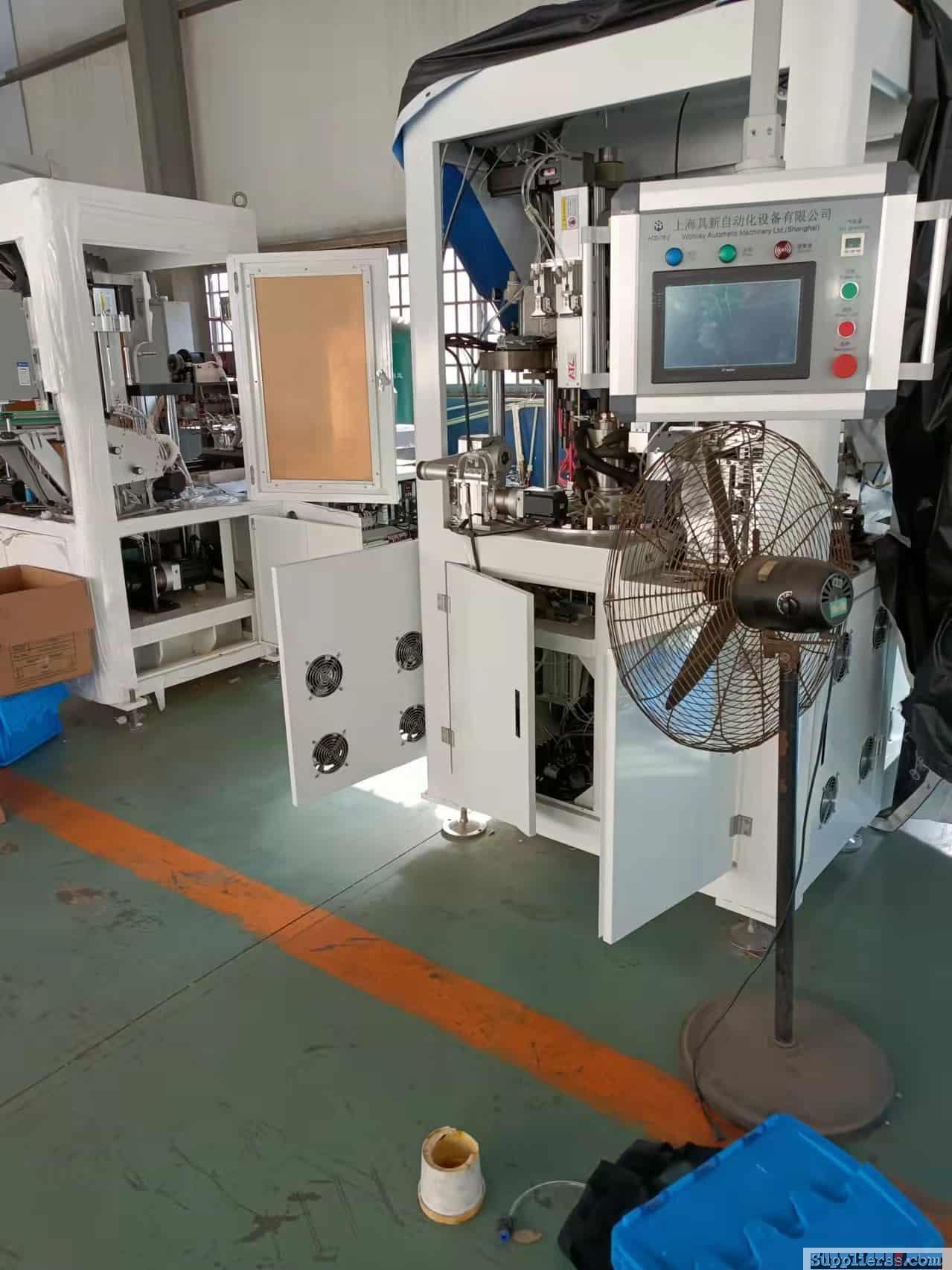 Automatic tube heading machine for cosmetic tubes